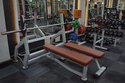 Public F2F listing photo showing a bench and strength station